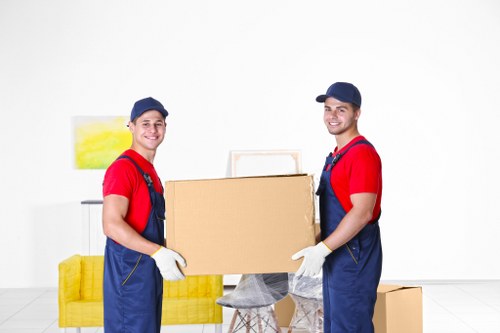House movers preparing a local move in Swisscottage near apartment buildings