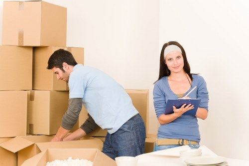 Unpacking and organising boxes in a Swisscottage home